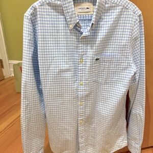 Button-up men’s Lacoste shirt.